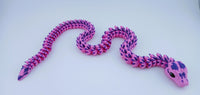 Pink and purple snake-shaped toy on a white background
