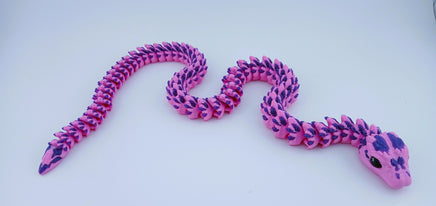 Pink and purple snake-shaped toy on a white background