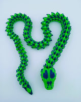 Green and blue snake-shaped toy on a white background